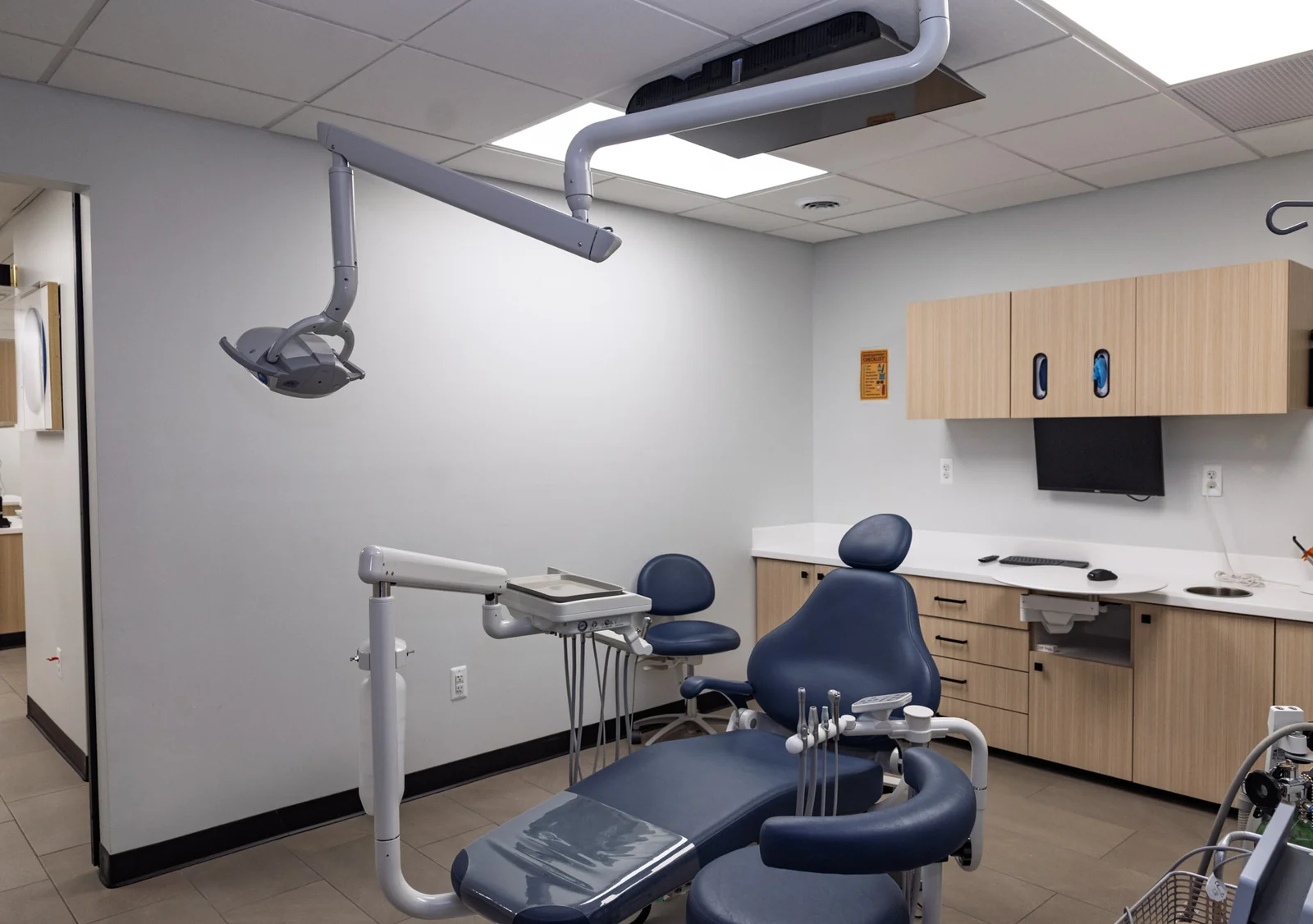 A calm patient sitting comfortably in a dental treatment chair