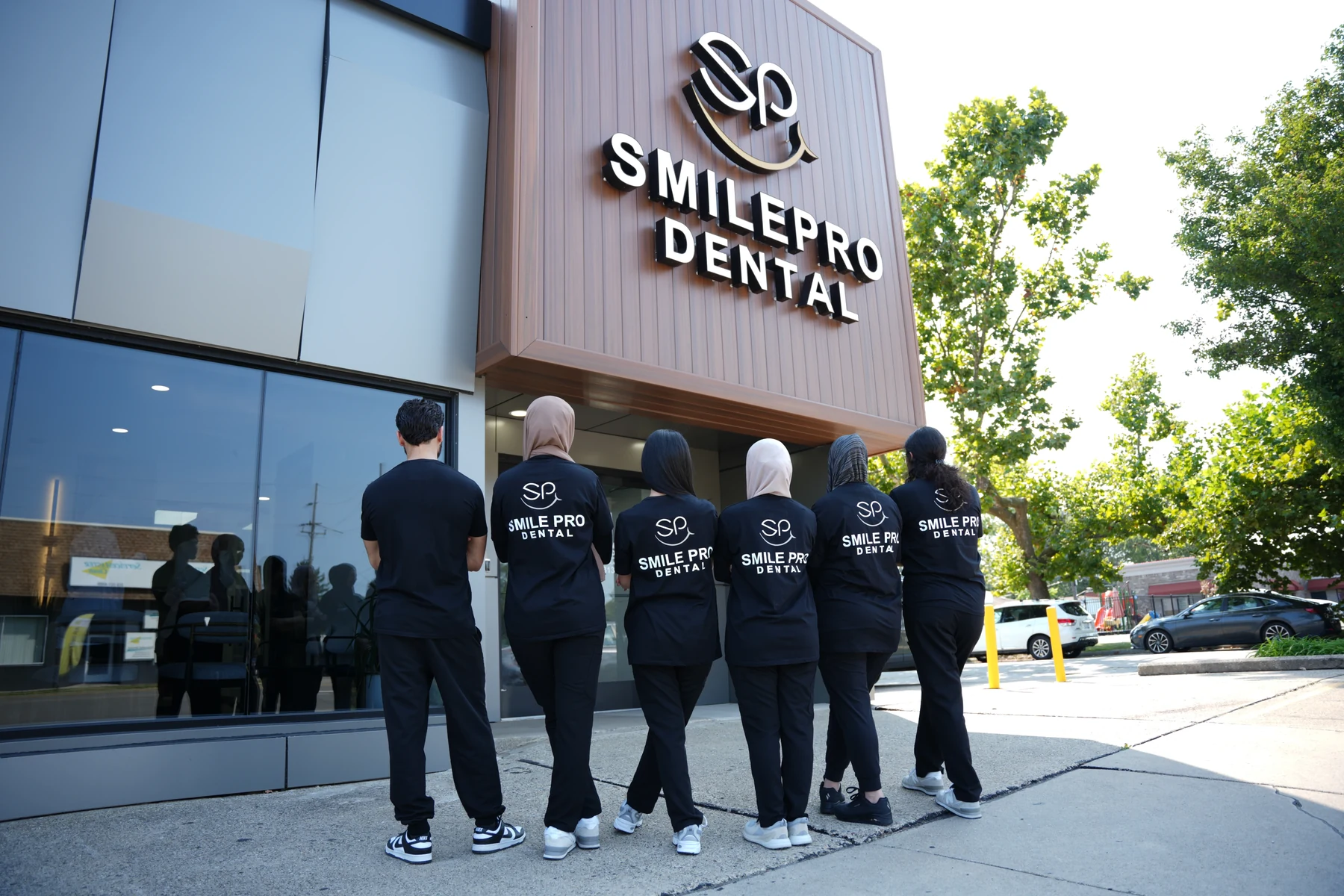 The SmilePro Dental team outside the practice in Dearborn Heights
